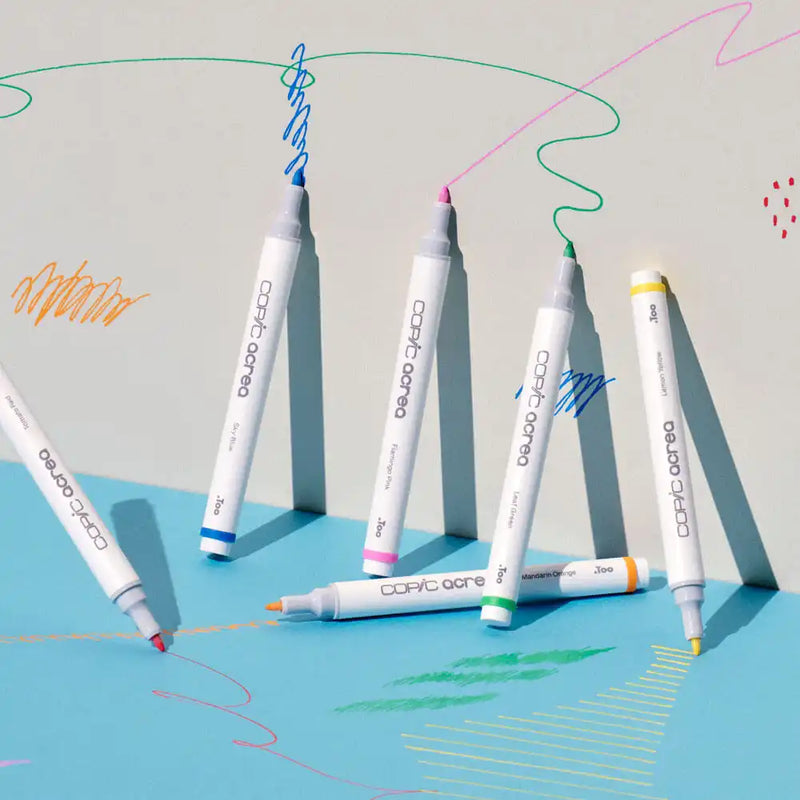 A collection of colorful art markers with light gray caps.