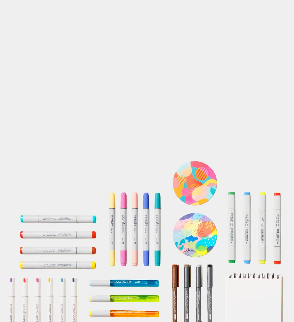 A collection of colorful art markers and drawing supplies.
