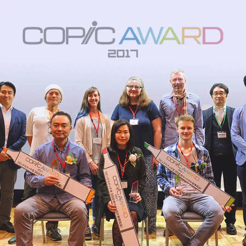 People holding awards at the Copic Award 2017 ceremony.