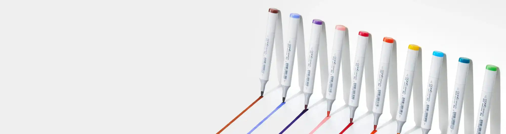 A row of colorful markers creating lines.