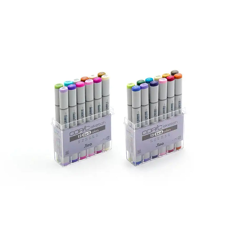 Two sets of 12 Copic Sketch markers in clear plastic cases.