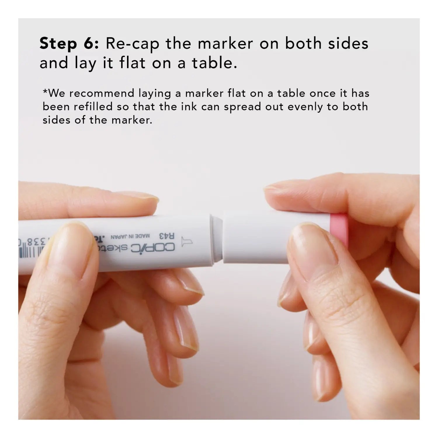 Step 6: Re-cap the marker on both sides and lay it flat on a table