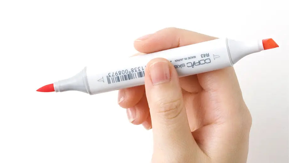 Copic Sketch marker uncapped on both sides of marker