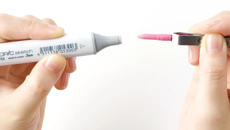 Tweezers pulling out Super Brush nib from Copic Sketch marker