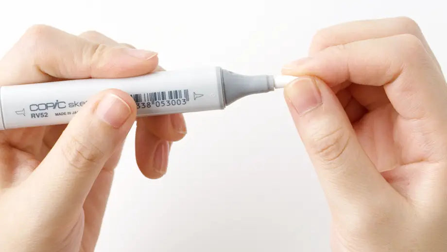 Hand inserting new Super Brush nib into Copic Sketch marker