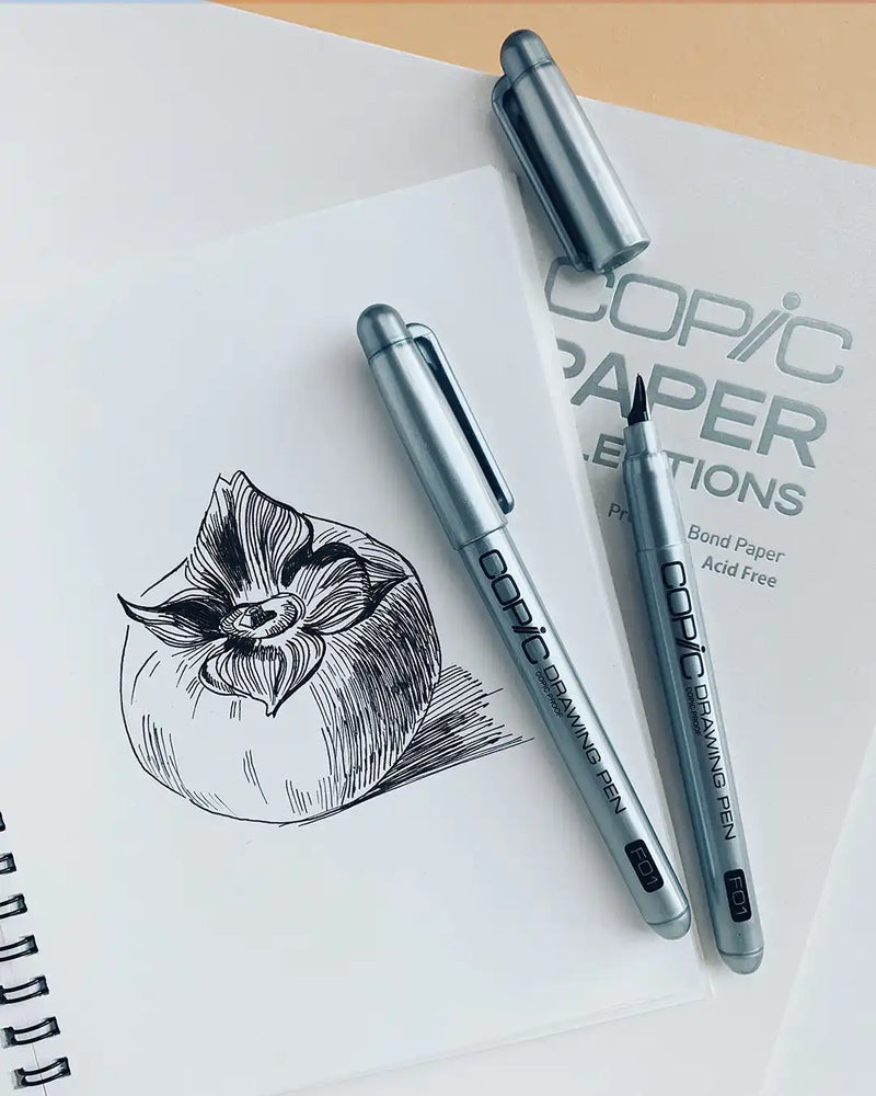 A monochrome sketch of a fruit on white paper, drawn with fine-tip pens.